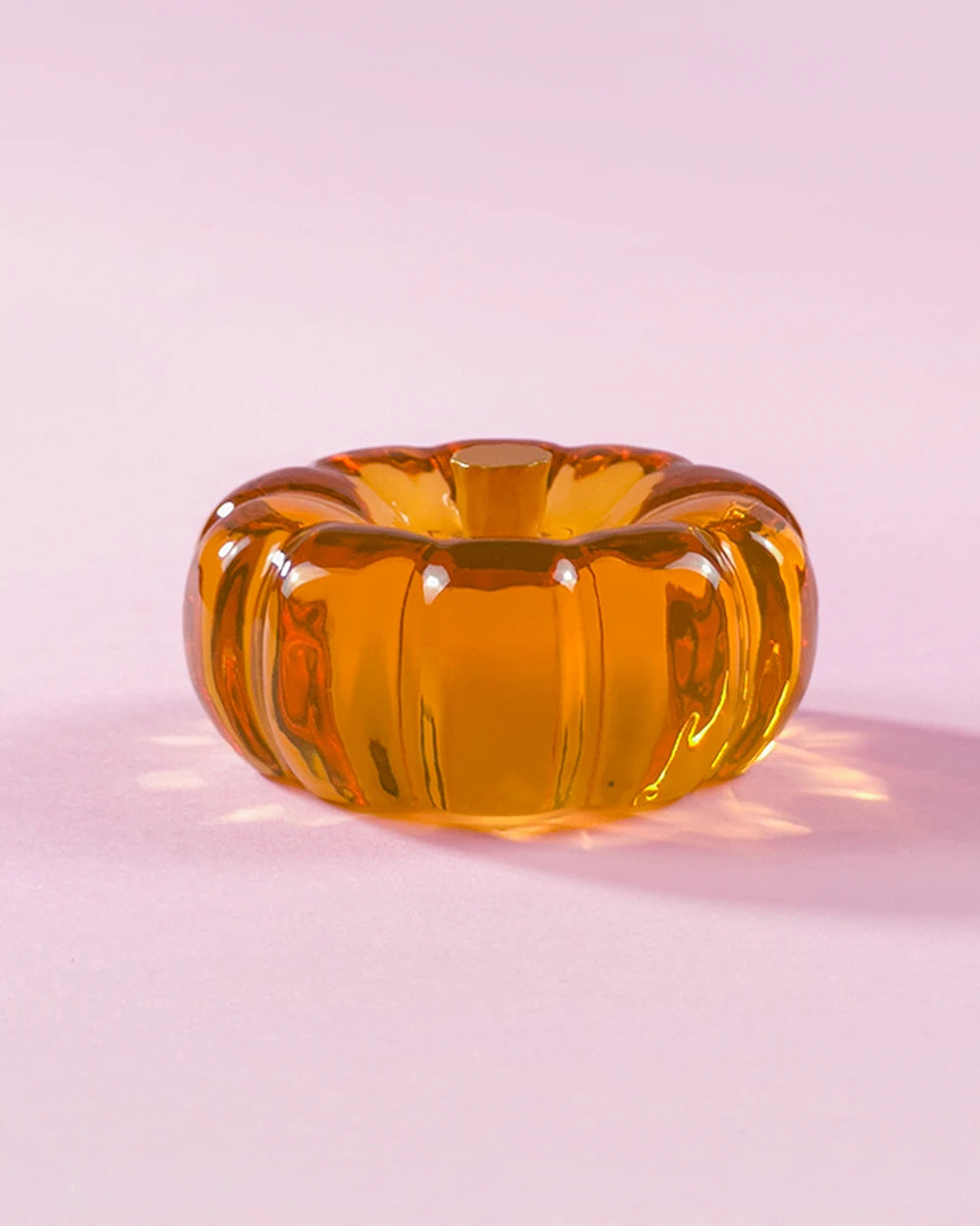 Amber orange resin specimen art object by momu. Handcrafted archival fragment with a warm, glowing amber tone.
