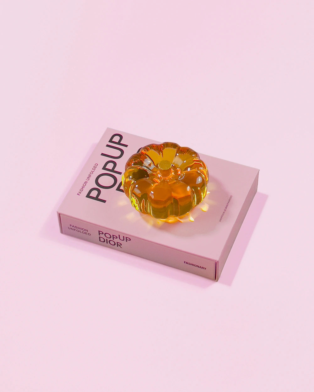 Amber orange resin specimen art object by momu. Handcrafted archival fragment with a warm, glowing amber tone.