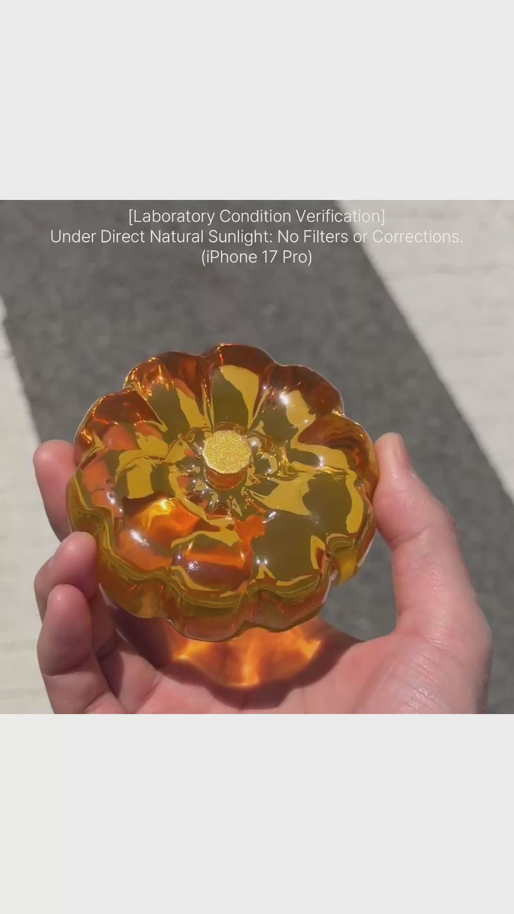 Amber orange resin specimen art object by momu. Handcrafted archival fragment with a warm, glowing amber tone.
