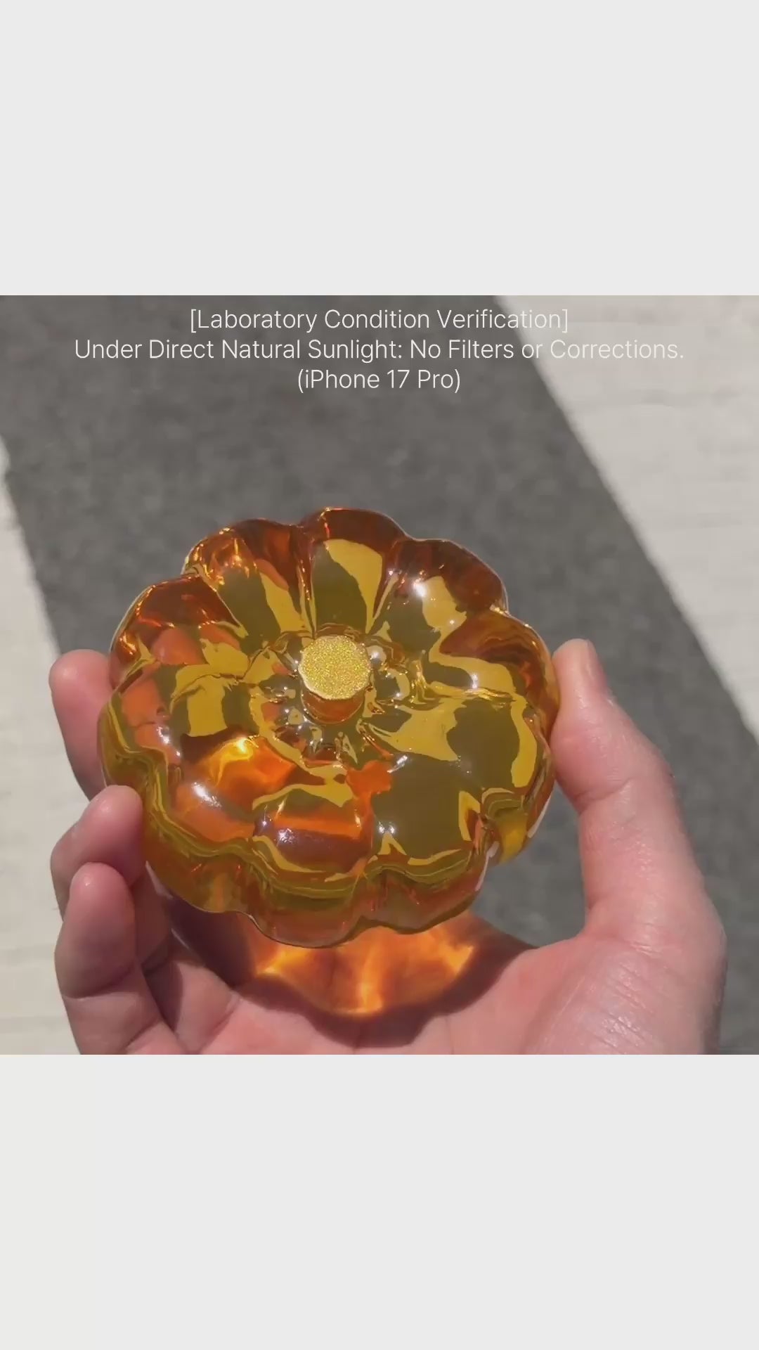 Amber orange resin specimen art object by momu. Handcrafted archival fragment with a warm, glowing amber tone.